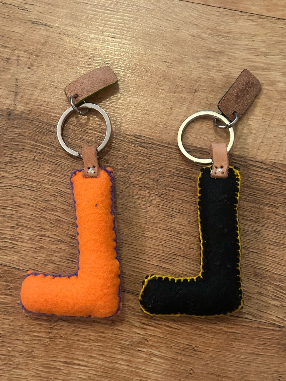 Consuela Two Embroidered Felt Letter “L” Bag Charms in Black and Orange - Picture 3 of 8